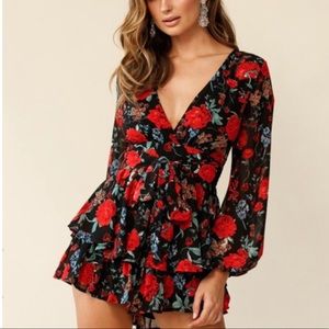 Red floral print ruffle romper.